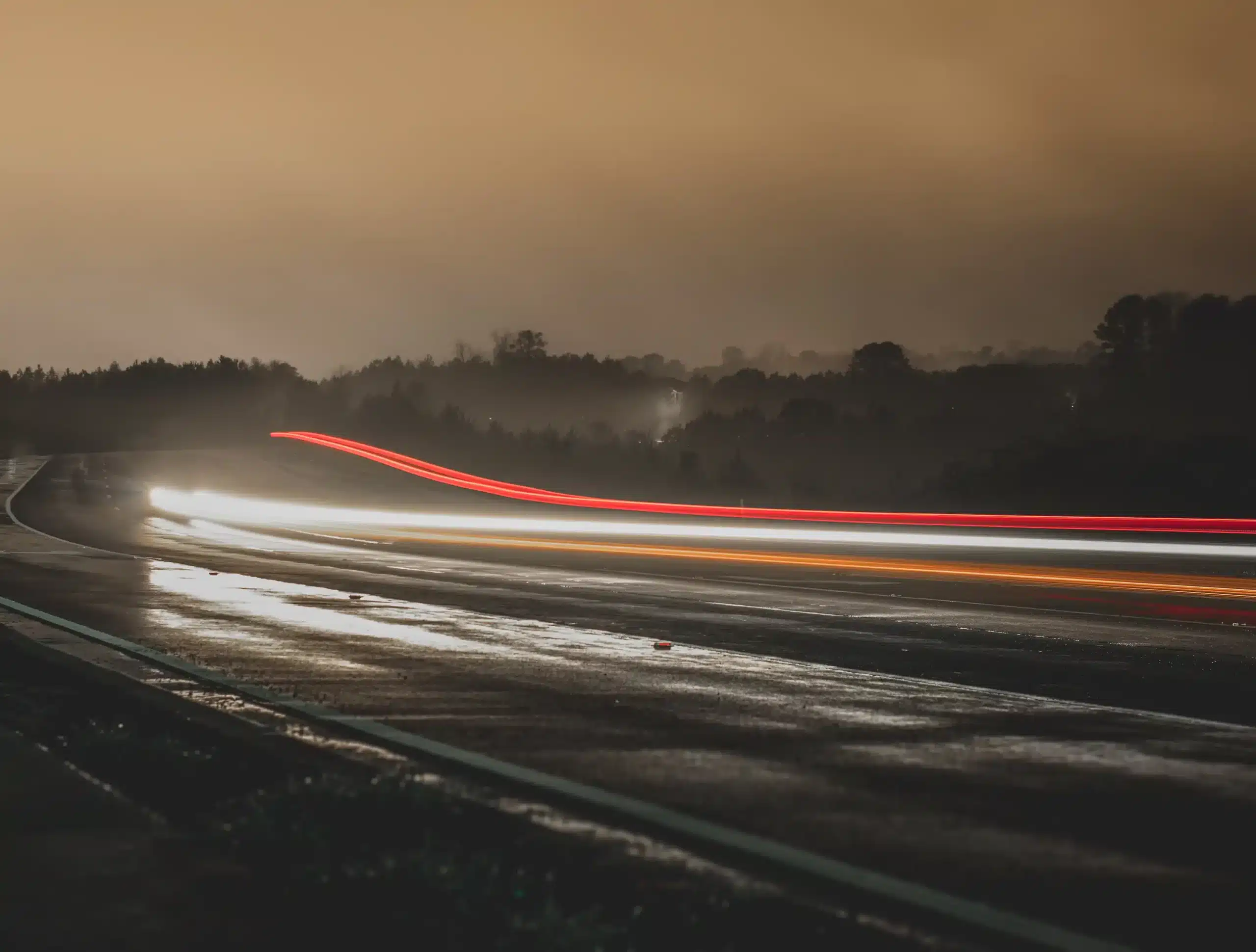 light trail of cars on highway